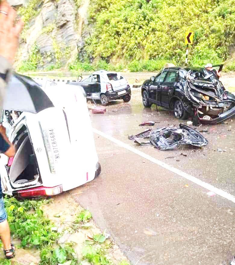 The three cars which were hit by falling rocks from the cliff overlooking NH 29 near the Chümoukedima police checkpost on July 4.